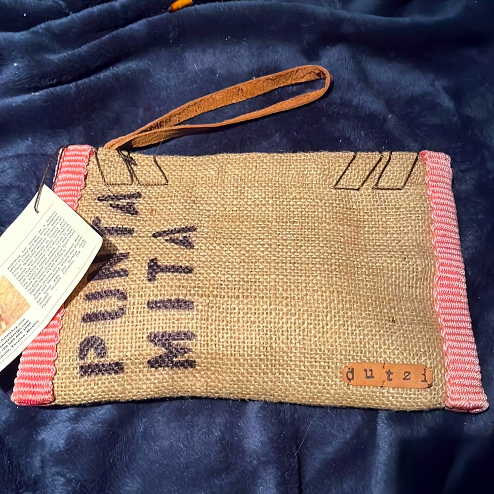 Dutzi clutch by designer Ariane Dutzi. Brand new with tag still attached.